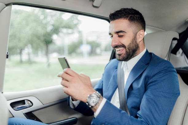 istock Handsome businessman riding in the car 1217822486