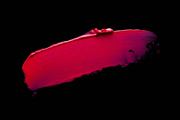 Bright red purple pink lipstick on black background Smudged red purple mustard yellow pink textured tint or lipstick on white and multi-colored background pale pink lipstick stock pictures, royalty-free photos & images