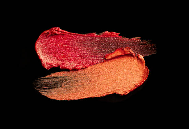 istock Bright red purple pink lipstick on black background 1217823241