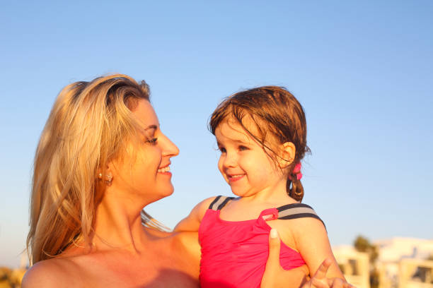 istock Happy family at the sunny beach 1217823256