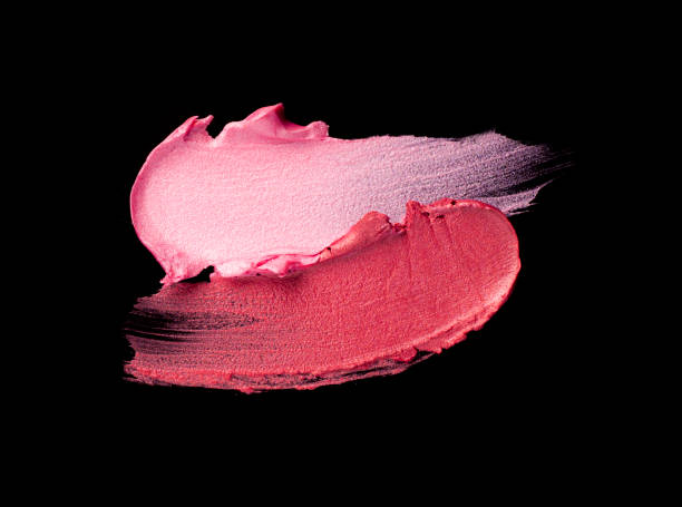 istock Bright red purple pink lipstick on black background 1217823735