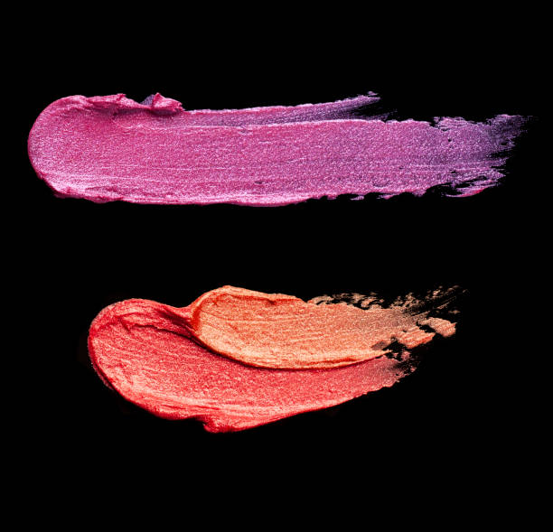 istock Bright red purple pink lipstick on black background 1217824513