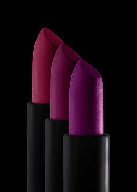 Smudged red purple mustard yellow pink textured tint or lipstick on white and multi-colored background