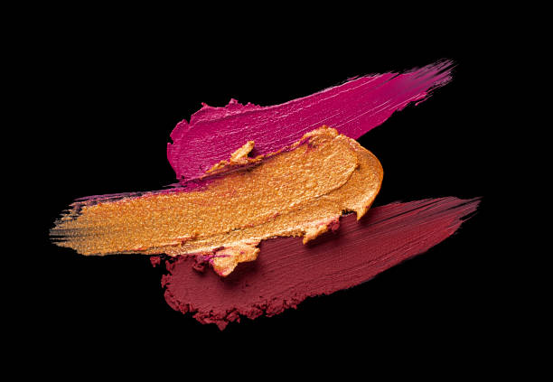 istock Bright red purple pink lipstick on black background 1217824589