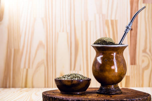 Chimarrão, or mate, is a characteristic drink of the culture of southern South America. mate bowl with mate herb, pump and accessories for preparing mate herb. Space for text. Traditional Argentinian, Brazilian and Uruguayan yerba tea in a gourd gourd with bombilla stick against wooden background gaucho stock pictures, royalty-free photos & images