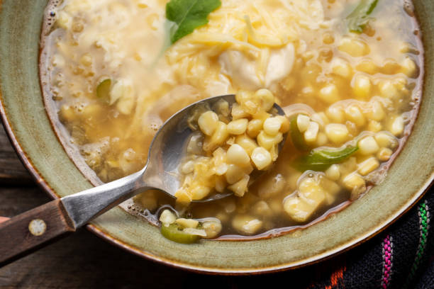 istock Mexican corn grain boiled also called esquites with cheese and mayonnaise on wooden background 1217825221