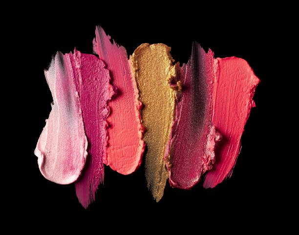 Bright red purple pink lipstick on black background