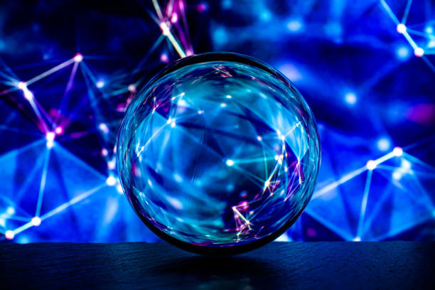 istock Crystal glass ball is lying on a stone surface on the colorful abstract background. 1217825710