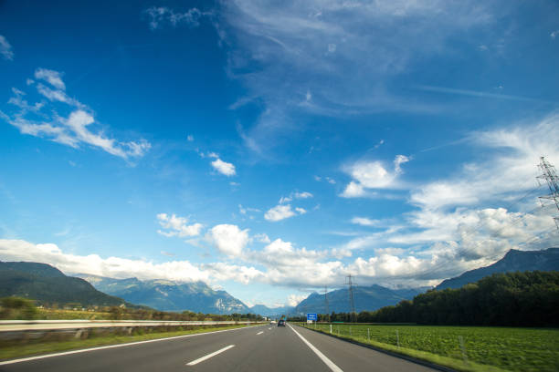istock Asphalt road in Switzerland, road between the Alps mountains 1217826889