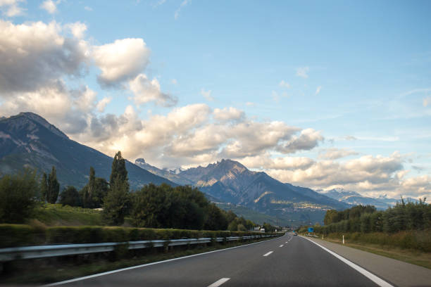 istock Asphalt road in Switzerland, road between the Alps mountains 1217826898