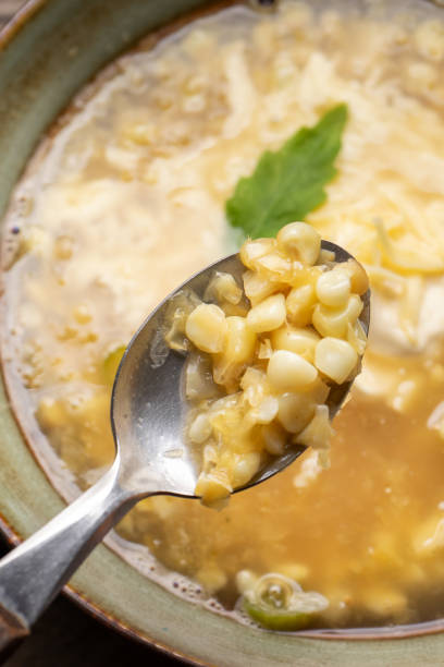 istock Mexican corn grain boiled also called esquites with cheese and mayonnaise on wooden background 1217827093