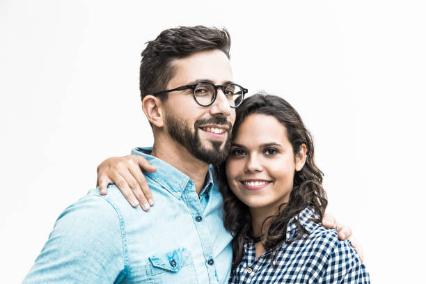istock Positive beautiful couple hugging and looking at camera 1217827711