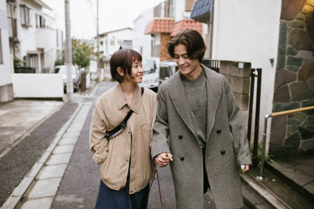 istock Young Couple Walking On the Street 1217827819