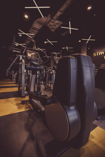istock Elliptical machine in an empty industrial looking gym 1217828328