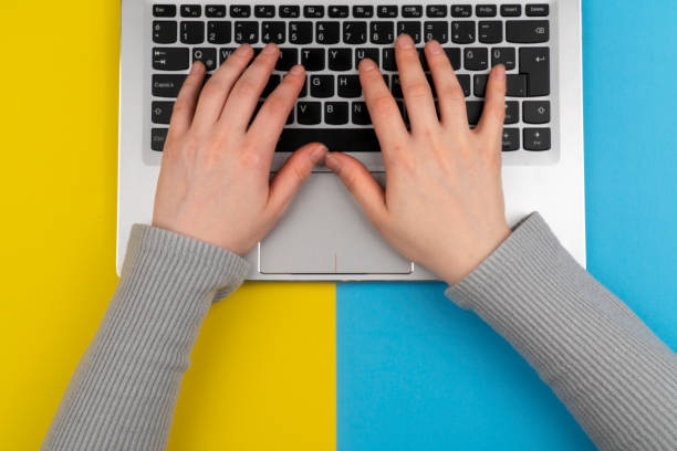 istock Person using a laptop computer stock photo 1217829050