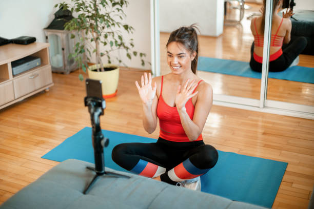 istock Beautiful woman teaching from home using a video chat 1217829831