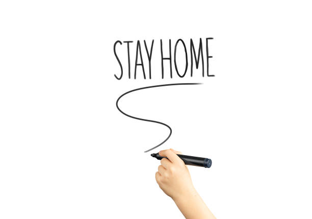istock marker in hand with the words stay home 1217830986