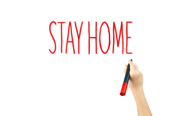 istock marker in hand with the words stay home 1217831072