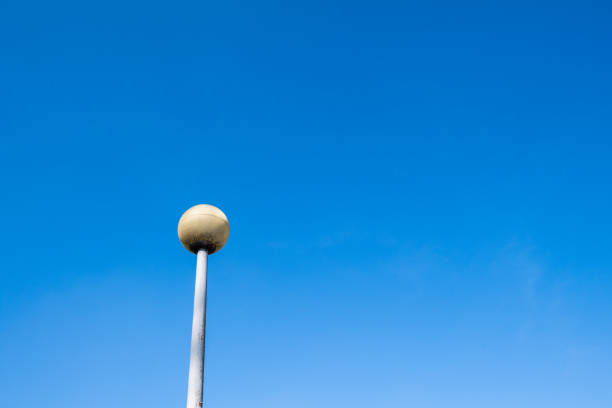 istock light pole with round corner against clear blue sky 1217832657