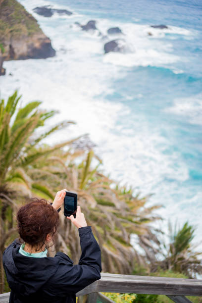 istock A young women taking photo 1217832838