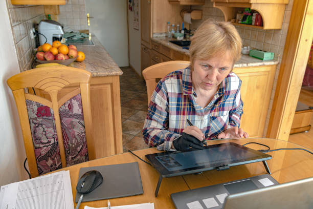 istock Senior Math Teacher Giving Lesson Using Laptop and Graphics Drawing Tablet 1217833757