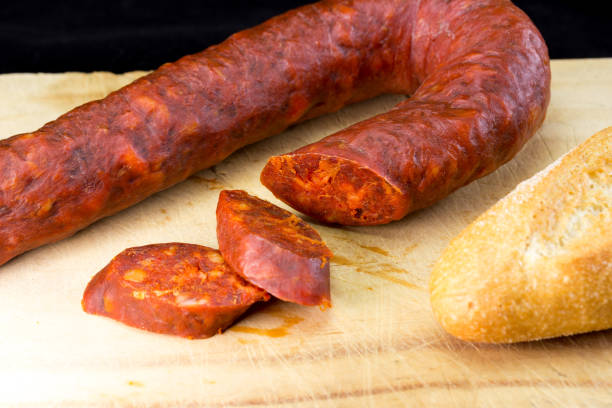 istock cut and sliced chorizo sausage on wooden board 1217834092