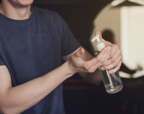 istock man with alcohol gel or antibacterial soap 1217835357