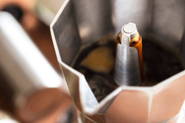 espresso coffee in a stove top moka espresso pot ,moka coffee maker close-up