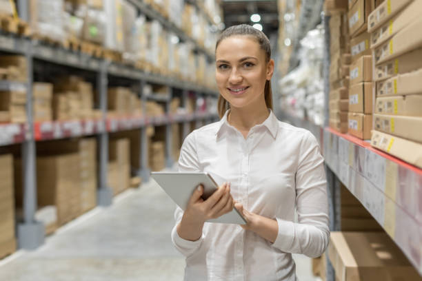 istock Young woman auditor working in warehouse store 1217838549