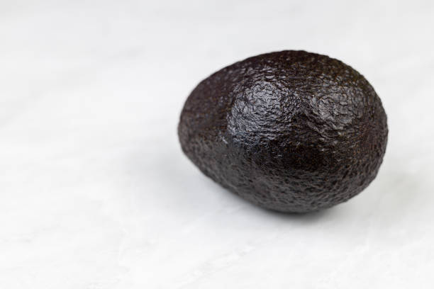 istock Isolated avocado on the white background 1217841067