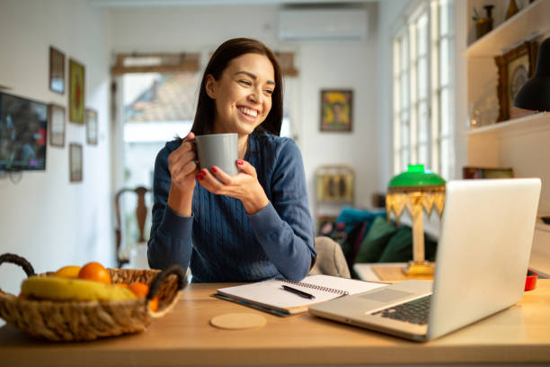 istock Beautiful young woman working from home 1217841941