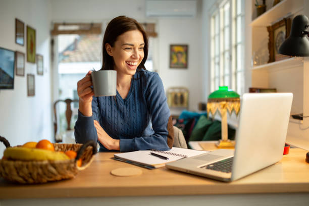 istock Beautiful young woman working from home 1217841970