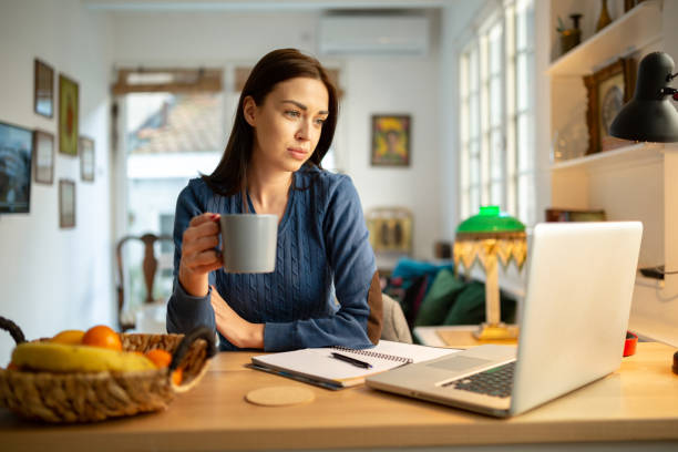 istock Attractive young woman working from home 1217842061
