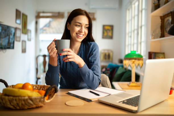 Beautiful young woman working from home
