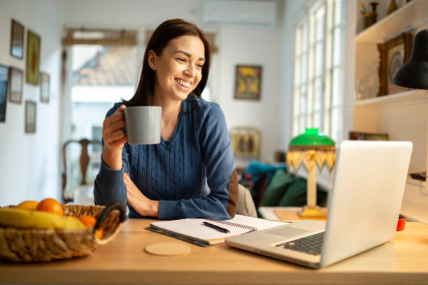 istock Beautiful young woman working from home 1217842628