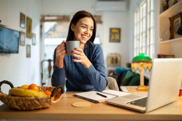 istock Beautiful young woman working from home 1217842644