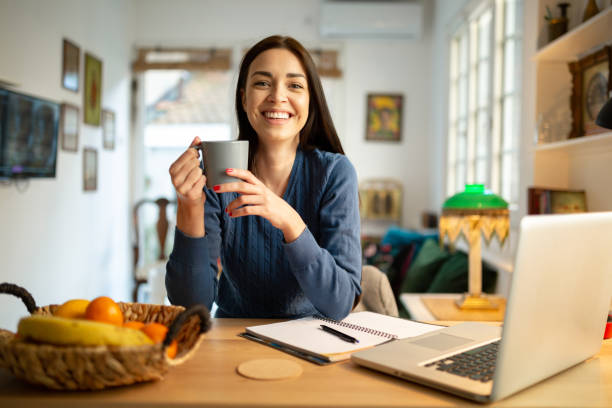 istock Beautiful young woman working from home 1217842725