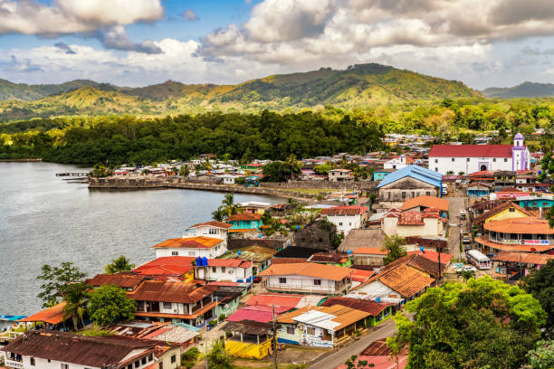Aerial view of Portobelo village from the Peru Lookout Point in Portobelo, Panama. Portobelo, Panama - Feb 28, 2020: Aerial view of Portobelo village with Fort Jeronimo defense walls as captured from the Peru Lookout Point in Portobelo, Panama. central america photos stock pictures, royalty-free photos & images