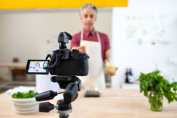istock Video camera recording a vlog of preparing pasta at home 1217846841