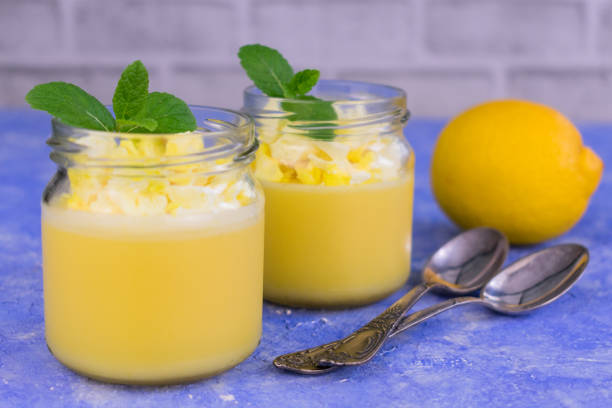 istock Lemon Kurd, a dessert decorated with mint on a light blue background. 1217848405