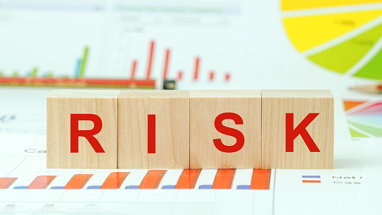 word risk inscription in red letters on wooden blocks business concept