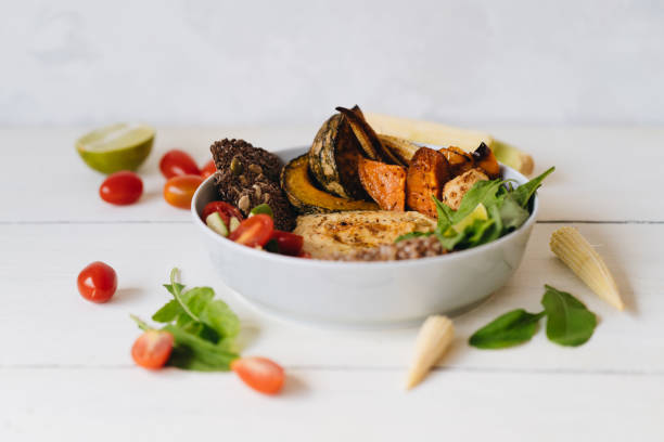 istock The plate with Hummus and vegetables on the white background 1217851360