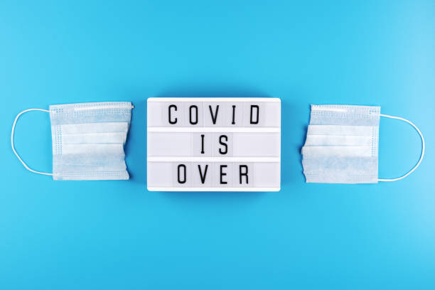 istock Cut medical mask and light box with text 
