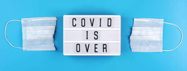istock Cut medical mask and light box with text 