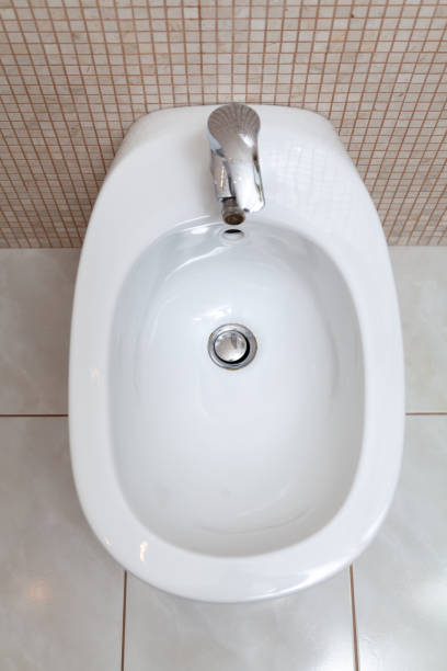 istock White bidet in bathroom top view 1217854782