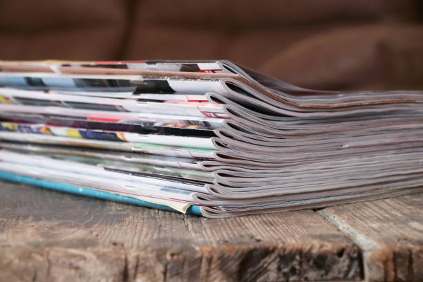 istock Old magazines on wooden table 1217857258
