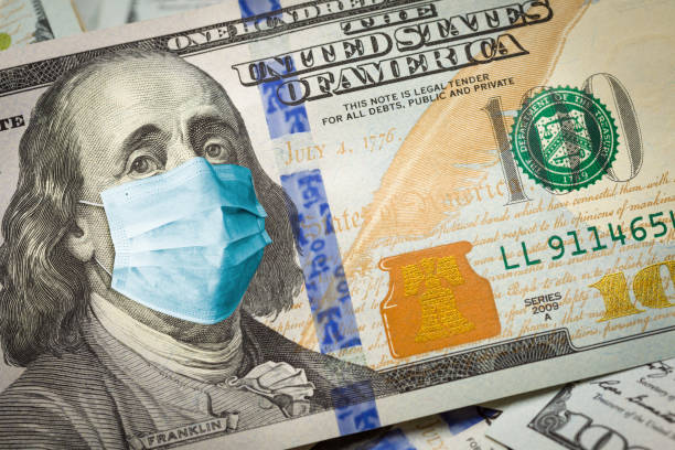 istock Benjamin Franklin With Worried and Concerned Expression Wearing Medical Face Mask On One Hundred Dollar Bill 1217857356