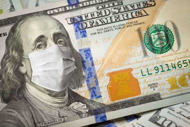istock Benjamin Franklin With Worried and Concerned Expression Wearing Medical Face Mask On One Hundred Dollar Bill 1217857440
