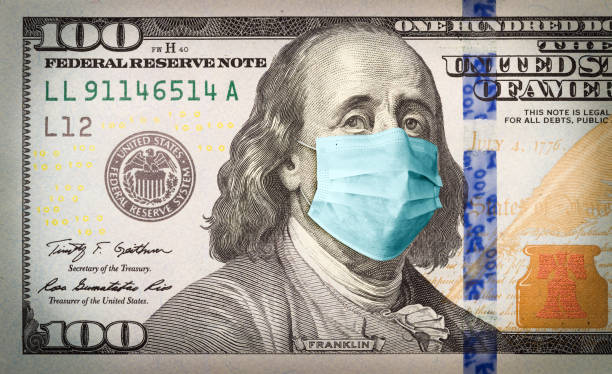 istock Benjamin Franklin With Worried and Concerned Expression Wearing Medical Face Mask On One Hundred Dollar Bill 1217857518