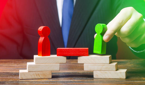 istock The man provides the conditions for negotiations and conflict resolution between opponents. Build bridges, improve relationships. Arbitrator, mediator. Search for compromise. Peace settlement 1217859990